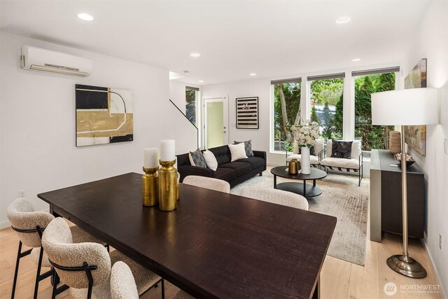 909 29th Ave S, Seattle, WA 98144 - living room with a wall mounted AC, light wood-type flooring, and recessed lighting