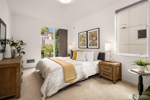 909 29th Ave S, Seattle, WA 98144 - bedroom with light carpet and access to exterior