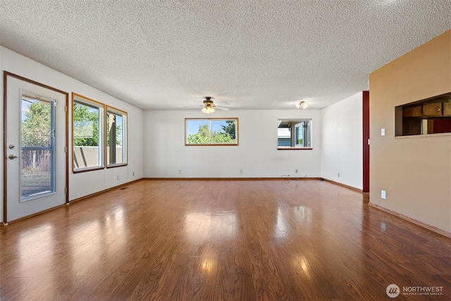 103 Crest Dr, Ephrata, WA 98823 - unfurnished room with a textured ceiling, a ceiling fan, and wood finished floors