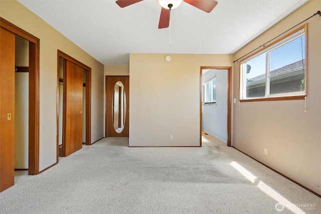 103 Crest Dr, Ephrata, WA 98823 - unfurnished bedroom featuring light colored carpet and ceiling fan