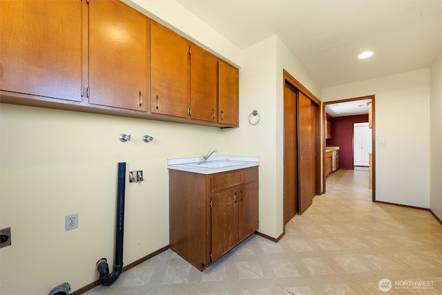 103 Crest Dr, Ephrata, WA 98823 - laundry room featuring cabinet space, hookup for an electric dryer, and light floors