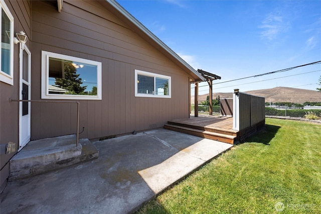 103 Crest Dr, Ephrata, WA 98823 - view of home's exterior featuring a wooden deck, a yard, and a patio area