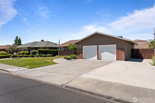 103 Crest Dr, Ephrata, WA 98823 - ranch-style home with an attached garage, brick siding, and concrete driveway