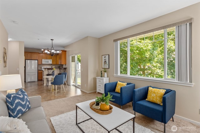 6125 Kennedy Ave SE Unit F7, Auburn, WA 98092 - living area with a chandelier and light colored carpet
