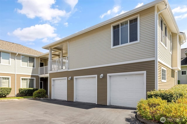 6125 Kennedy Ave SE Unit F7, Auburn, WA 98092 - view of home's exterior with a garage and asphalt driveway