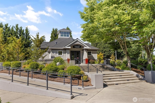 6125 Kennedy Ave SE Unit F7, Auburn, WA 98092 - view of front of home featuring board and batten siding and a fenced front yard