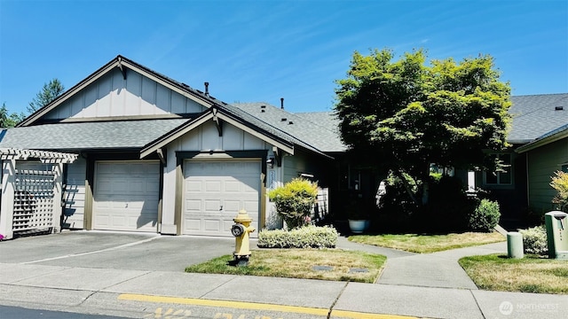 23884 NE 112th Cir Unit 2, Redmond, WA 98053 - ranch-style home featuring board and batten siding, a garage, roof with shingles, and concrete driveway