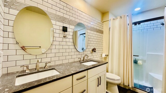 23884 NE 112th Cir Unit 2, Redmond, WA 98053 - full bathroom featuring tile walls, decorative backsplash, curtained shower, and double vanity
