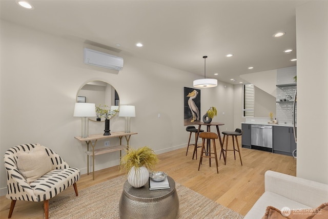 1106C 34th Ave, Seattle, WA 98122 - living area with a wall mounted AC, bar with sink, light wood-style flooring, and recessed lighting