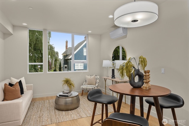 1106C 34th Ave, Seattle, WA 98122 - sitting room featuring a wall mounted air conditioner, wood finished floors, and recessed lighting
