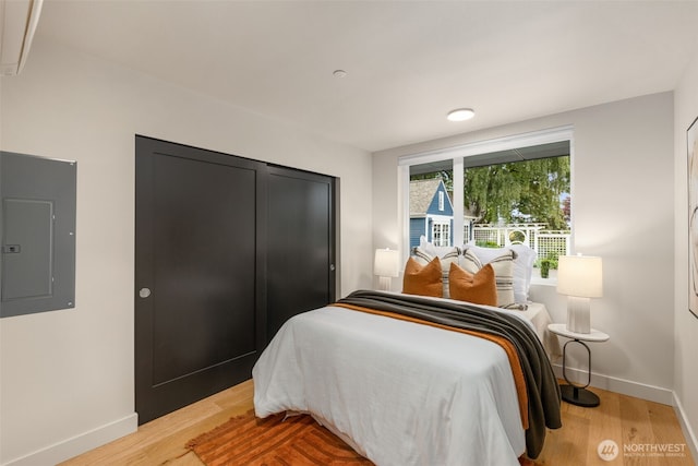 1106C 34th Ave, Seattle, WA 98122 - bedroom featuring electric panel, light wood-type flooring, and a closet