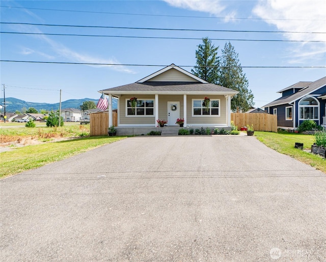 235 Morton St, Sumas, WA 98295 - bungalow featuring asphalt driveway, covered porch, and a mountain view