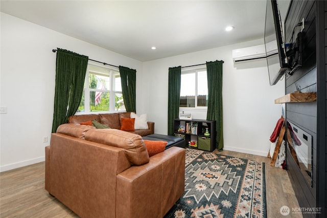 235 Morton St, Sumas, WA 98295 - living room with wood finished floors, recessed lighting, and a wall mounted AC