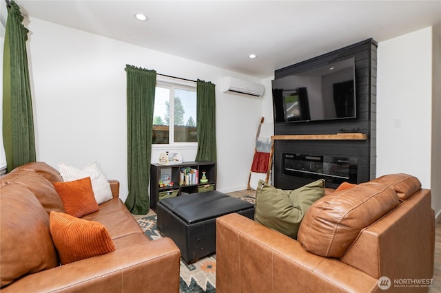 235 Morton St, Sumas, WA 98295 - living area featuring an AC wall unit, recessed lighting, wood finished floors, and a fireplace