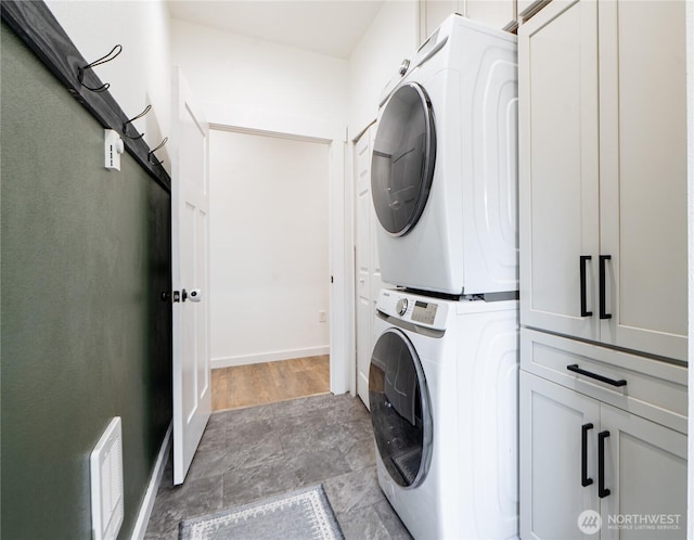 235 Morton St, Sumas, WA 98295 - washroom with stacked washer / dryer and cabinet space