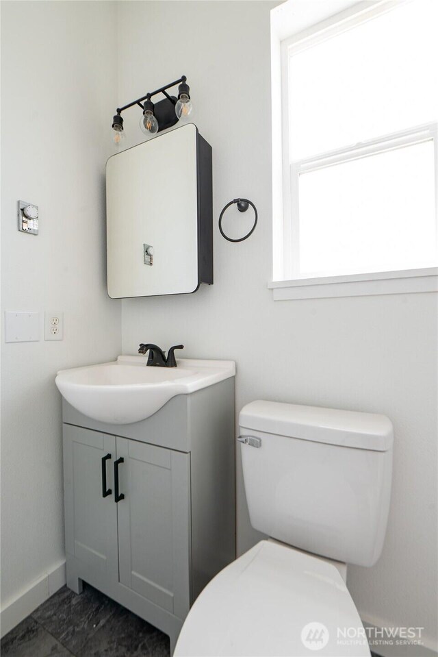 235 Morton St, Sumas, WA 98295 - half bathroom with vanity and marble look tiles