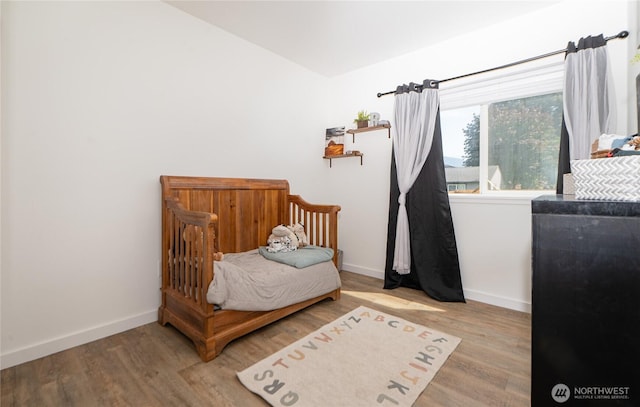 235 Morton St, Sumas, WA 98295 - bedroom featuring wood finished floors and vaulted ceiling