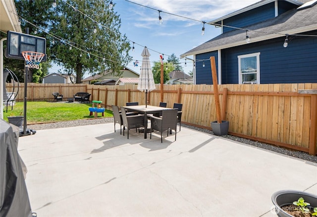 235 Morton St, Sumas, WA 98295 - fenced backyard with a patio, outdoor dining space, and an outdoor fire pit