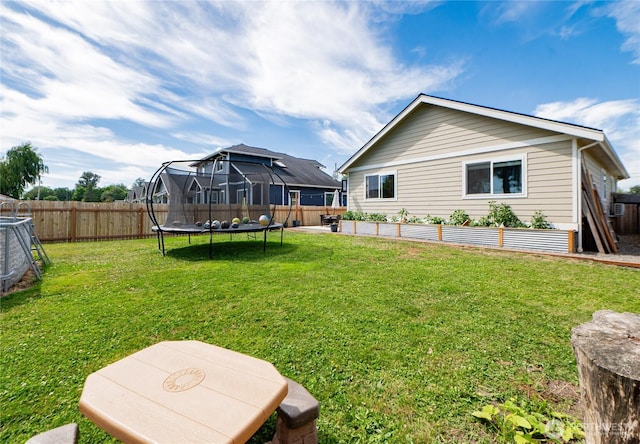 235 Morton St, Sumas, WA 98295 - rear view of house featuring a trampoline and a fenced backyard