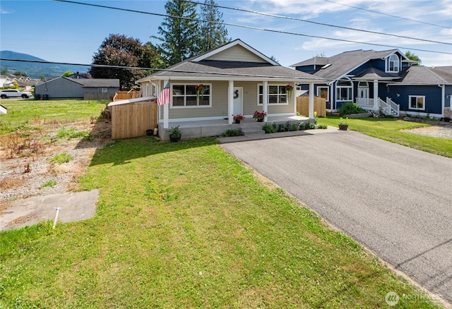 235 Morton St, Sumas, WA 98295 - view of front of house with covered porch, a front lawn, and asphalt driveway