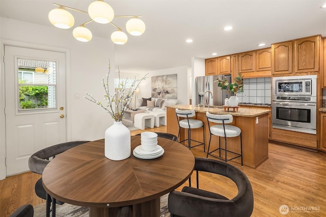 1417 232nd Pl SW, Bothell, WA 98021 - dining space featuring light wood finished floors and recessed lighting