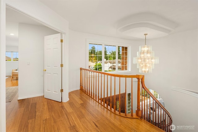 1417 232nd Pl SW, Bothell, WA 98021 - corridor with an upstairs landing, wood finished floors, a chandelier, healthy amount of natural light, and recessed lighting