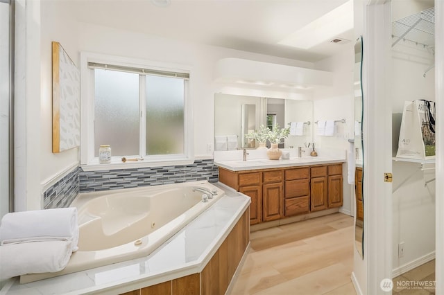 1417 232nd Pl SW, Bothell, WA 98021 - bathroom featuring double vanity, a whirlpool tub, and a walk in closet