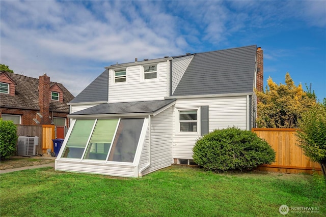 4840 E B St, Tacoma, WA 98404 - back of property featuring a sunroom, a shingled roof, and a chimney