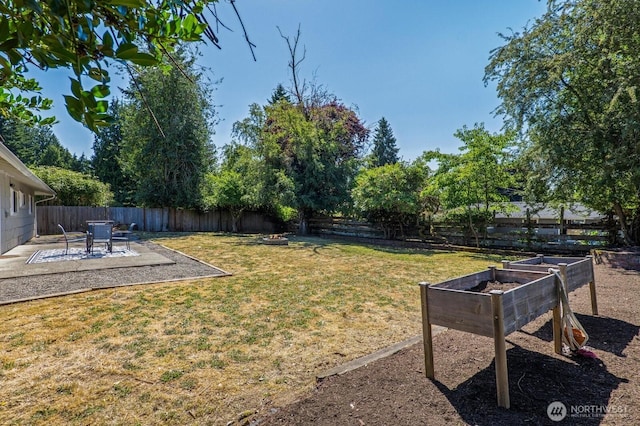 3923 NE 22nd Pl, Renton, WA 98056 - fenced backyard featuring a patio area and a garden