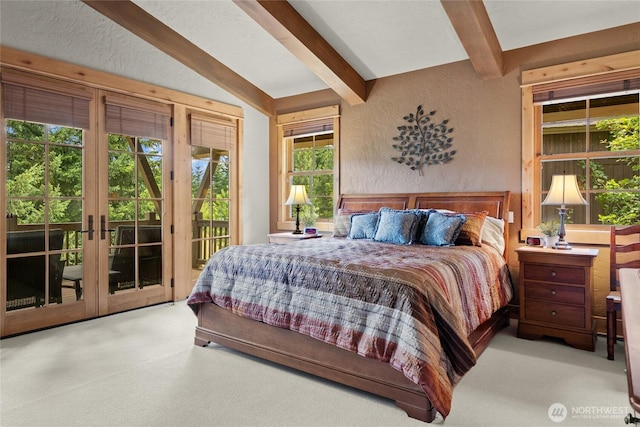 80 Queens Loop, Cle Elum, WA 98922 - carpeted bedroom featuring beam ceiling, access to outside, and a textured wall