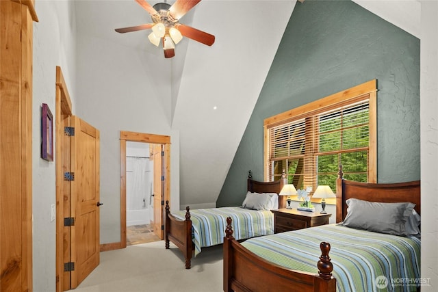 80 Queens Loop, Cle Elum, WA 98922 - bedroom featuring carpet floors, vaulted ceiling, ensuite bath, ceiling fan, and a textured wall