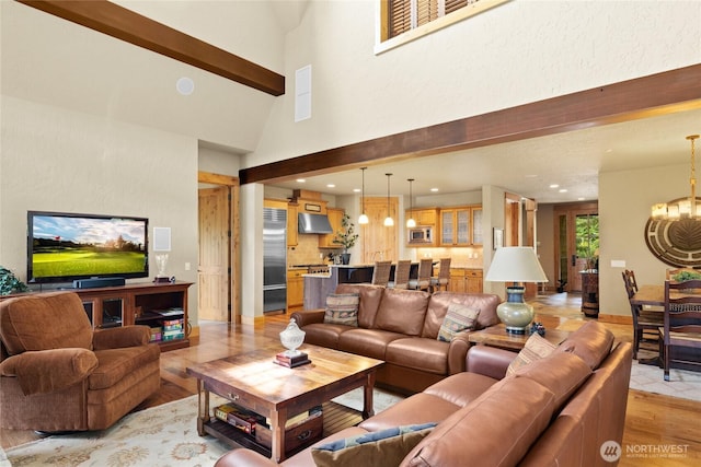 80 Queens Loop, Cle Elum, WA 98922 - living room featuring light wood finished floors, recessed lighting, a chandelier, beamed ceiling, and a high ceiling