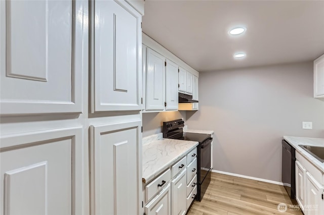 7435 Old Redmond Rd Unit 325, Redmond, WA 98052 - kitchen with black appliances, under cabinet range hood, white cabinetry, light wood finished floors, and light stone countertops