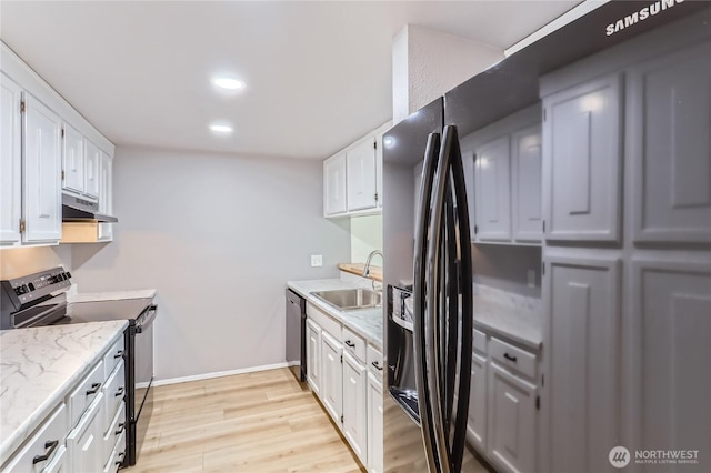7435 Old Redmond Rd Unit 325, Redmond, WA 98052 - kitchen featuring range with electric cooktop, under cabinet range hood, light wood finished floors, white cabinets, and recessed lighting