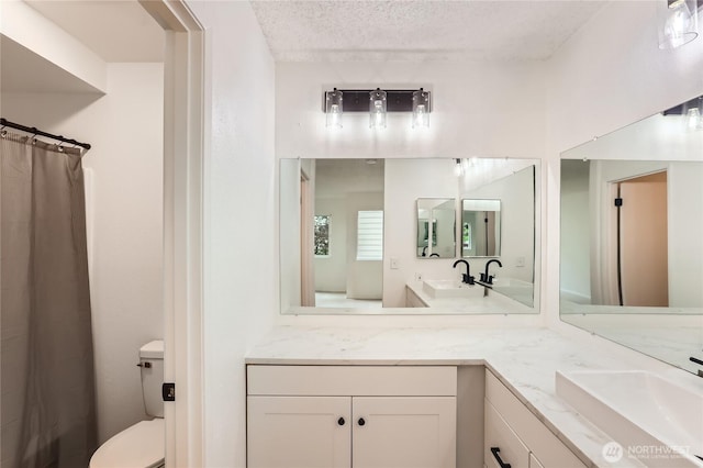 7435 Old Redmond Rd Unit 325, Redmond, WA 98052 - bathroom featuring vanity and a textured ceiling