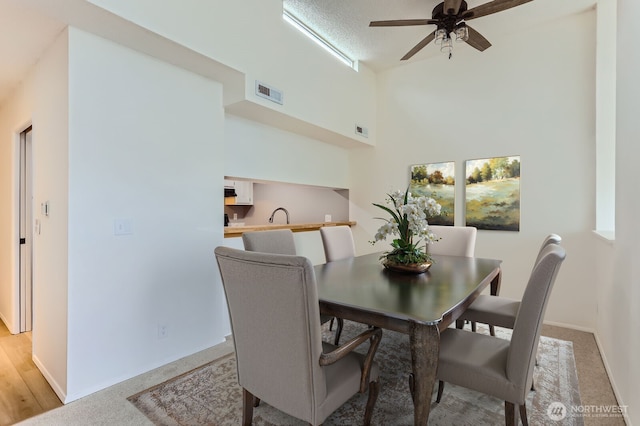 7435 Old Redmond Rd Unit 325, Redmond, WA 98052 - dining space featuring a ceiling fan and baseboards