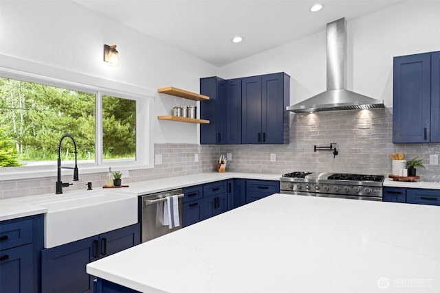 2403 E Hemmi Rd, Bellingham, WA 98226 - kitchen featuring wall chimney exhaust hood, blue cabinetry, and recessed lighting