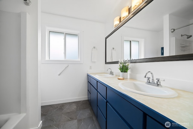 2403 E Hemmi Rd, Bellingham, WA 98226 - bathroom with double vanity and marble finish flooring