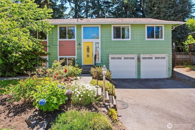 5428 172nd St SW, Lynnwood, WA 98037 - split foyer home featuring asphalt driveway and an attached garage