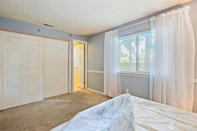 5428 172nd St SW, Lynnwood, WA 98037 - carpeted bedroom with a textured ceiling and a closet