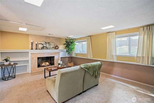 5428 172nd St SW, Lynnwood, WA 98037 - carpeted living area with a textured ceiling and a fireplace with flush hearth