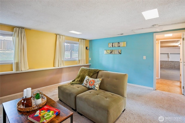 5428 172nd St SW, Lynnwood, WA 98037 - carpeted living room featuring a textured ceiling and baseboards