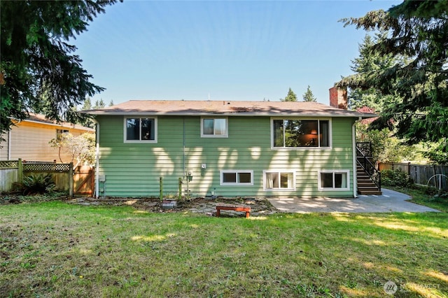 5428 172nd St SW, Lynnwood, WA 98037 - rear view of property featuring a patio, a chimney, and stairs