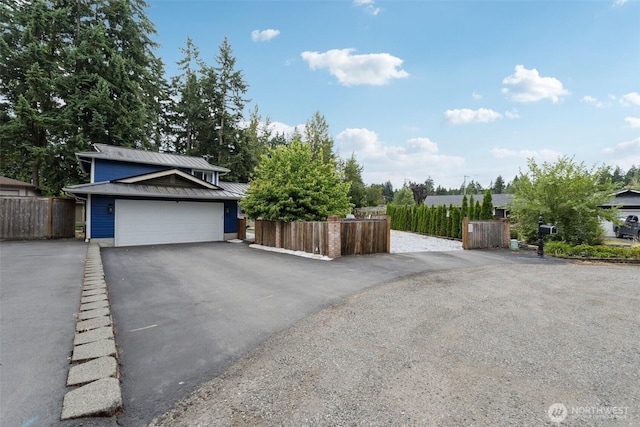 5502 82nd Street Ct E, Puyallup, WA 98371 - view of front facade with a garage and asphalt driveway
