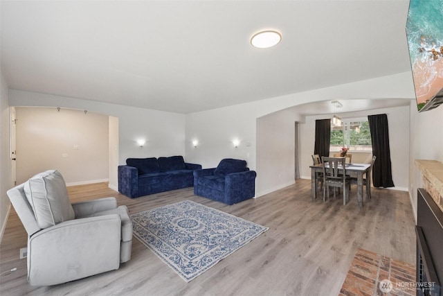 5502 82nd Street Ct E, Puyallup, WA 98371 - living area featuring light wood finished floors and arched walkways