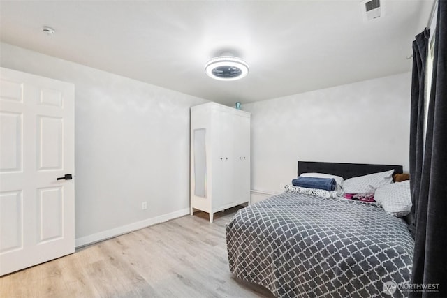5502 82nd Street Ct E, Puyallup, WA 98371 - bedroom featuring wood finished floors and baseboards