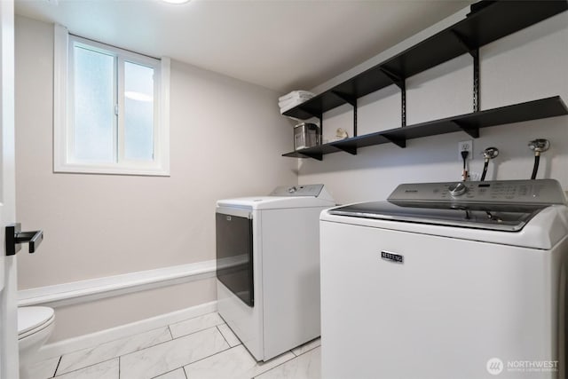 5502 82nd Street Ct E, Puyallup, WA 98371 - laundry area with washing machine and dryer and light marble finish floors