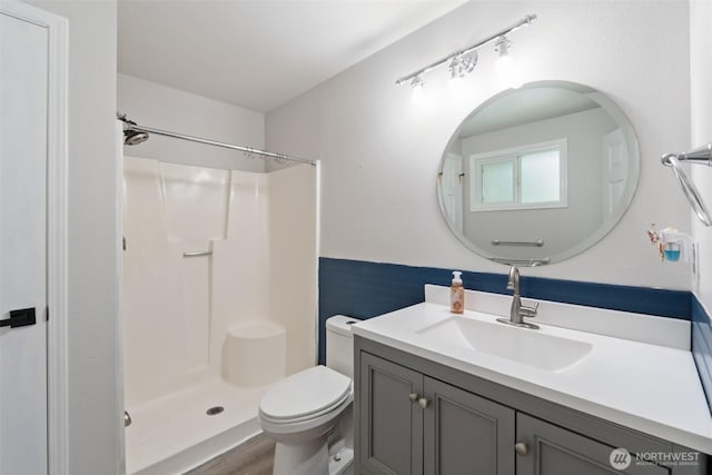 5502 82nd Street Ct E, Puyallup, WA 98371 - bathroom with a shower, vanity, and wood finished floors