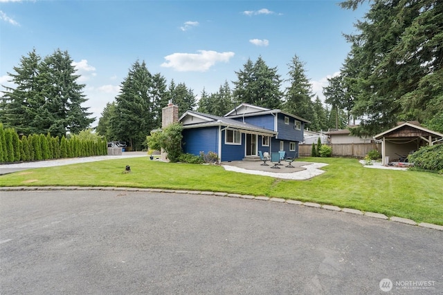 5502 82nd Street Ct E, Puyallup, WA 98371 - view of front facade with a chimney and a patio