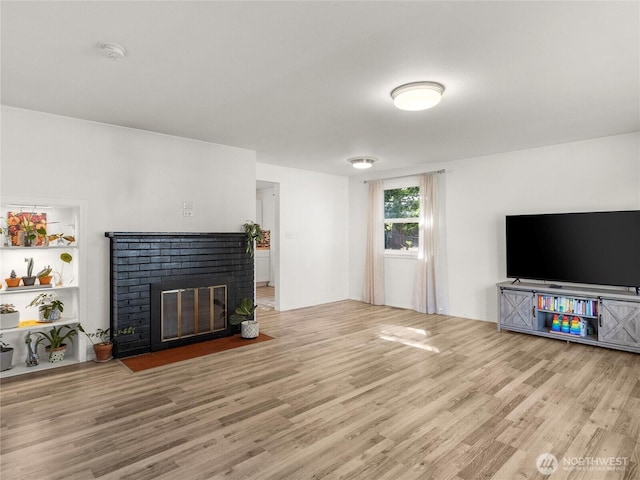 8839 S Yakima Ave, Tacoma, WA 98444 - unfurnished living room with wood finished floors and a fireplace